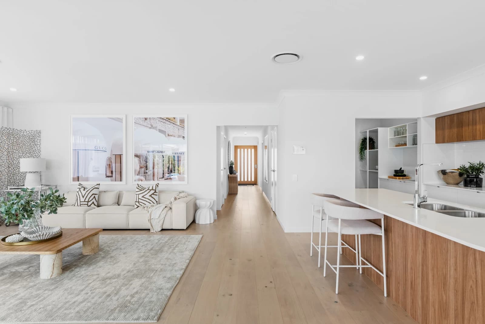 Open-plan living room and kitchen with timber floors in Pallara, Brisbane