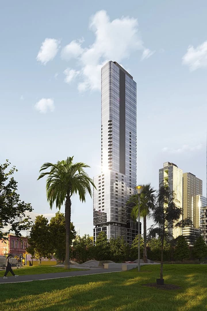 Slender apartment tower rising above palm trees in Southbank, Melbourne