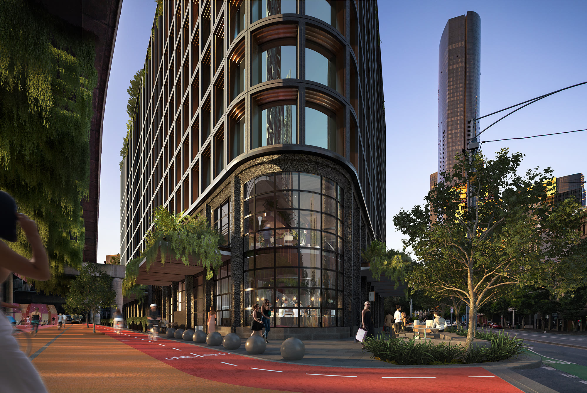 High-rise tower rising above a curved street-level facade in CBD, Melbourne