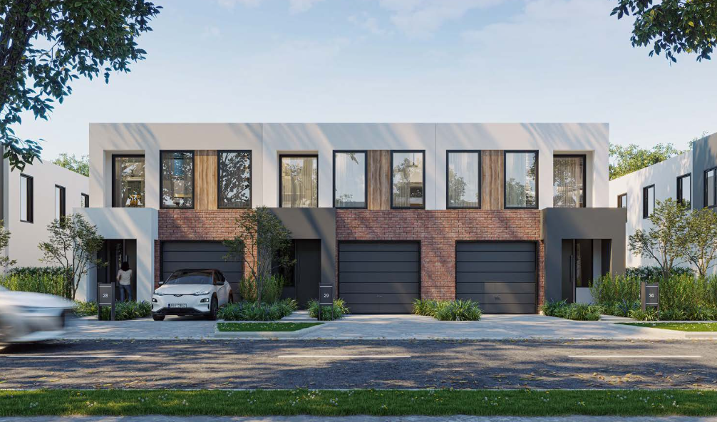 Brick townhouses with garages and landscaped front gardens in Mernda, Melbourne