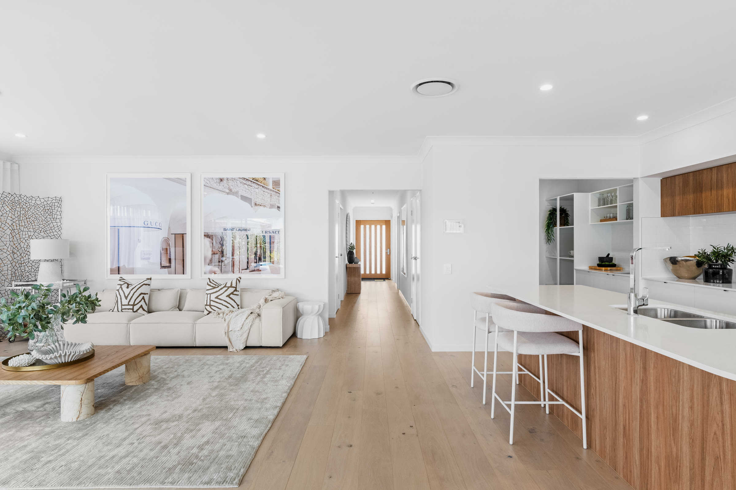 Open-plan living room and kitchen with timber floors in Pallara, Brisbane