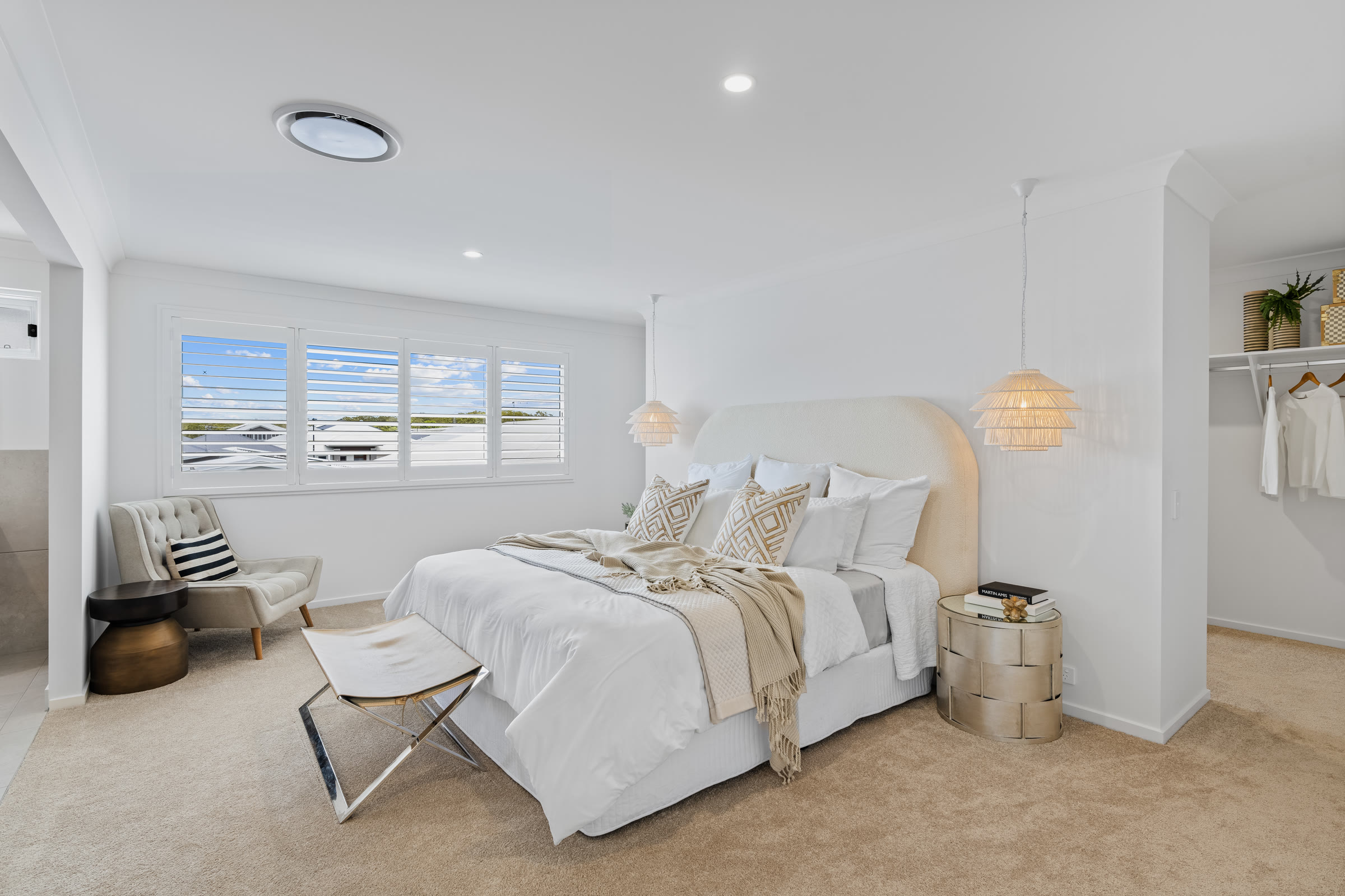 Bedroom with a curved headboard and corner window in Redbank Plains, Brisbane